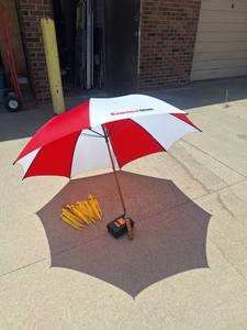 lot 86 image: Waterproof Survival Kit with Over 4 Foot  Umbrella and Large Tent Stakes