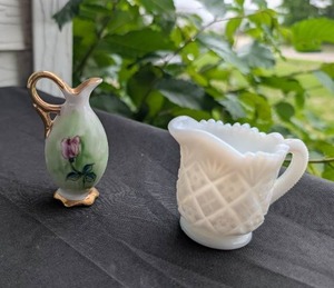 lot 1712 image: Decorative Porcelain Pitcher and Milk Glass Creamer Set