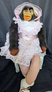 lot 4002 image: Monkey Doll in Pink Wedding Dress in a chair - 22 in&nbsp