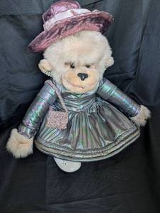 lot 4015 image: Plush Monkey with Holographic Dress and Two Hats