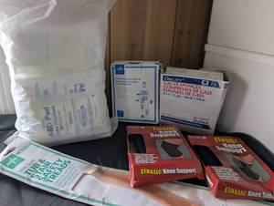 lot 5010 image: Medical Supply Bundle - Gauze Sponges, Elastic Netting, Knee Supports, Absorbent Pads
