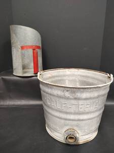 lot 203 image: VTG Rustic Galvanized Metal Farm Scoop with Red Handle and Galvanized CALF-TERIA Galvanized Metal  Bucket