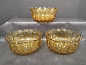 lot 214 image: Vintage, Three Anchor Hocking Honey Amber Glass Serving Bowls with Scalloped Edges, 9 inches