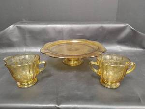 lot 221 image: Vintage Yellow Amber Glass Depression Era Creamer and Sugar Set with Cake Stand. Cake Stand Needs Repair