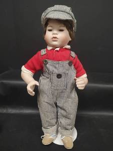 lot 297 image: Vintage 1992 P & O First Kiss Boy Doll, Porcelain Face, Arms and Feet