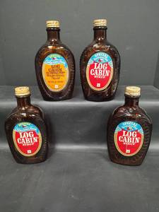 lot 328 image: Vintage Log Cabin Syrup Bottles Bicentennial 1776-1976