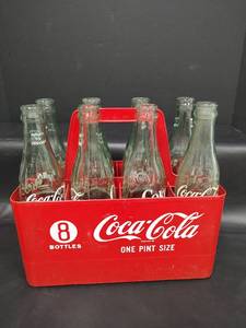 lot 356 image: Vintage 10 oz Coca-Cola Glass Bottles with Red Plastic Carrier
