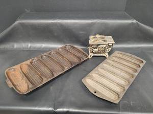 lot 396 image: Vintage Cast Iron Toy Stove and Corn Bread Molds