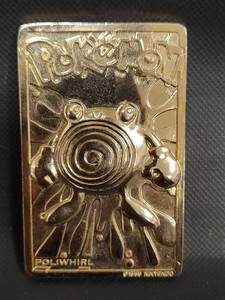 lot 587 image: 1999 Pokemon Poliwhirl Gold Plated Metal Trading Card