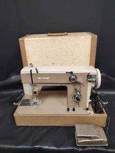 lot 596 image: Vintage Nelco Portable Sewing Machine with Case and Foot Pedal