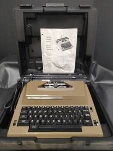lot 601 image: Vintage Sears The Graduate Electric Portable Typewriter with Case and Manual