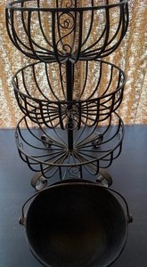 lot 65 image: Metal Plant HolderBaskets and a Cast Iron Bowl w Handle