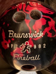 lot 82 image: Brunswick Bowling Ball w Plaid Bag