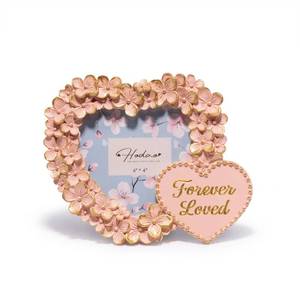 lot 2097 image: Hodao Heart Floral Photo Frame 4x4, Pink Gold Heart-Shaped Resin Frame with Acrylic Front, Hand-Painted Tabletop Keepsake for Mother��s Day, Anniversary & Mom Gift