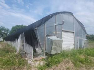 Commercial Greenhouse with Exhaust Fans and Growing Equipment