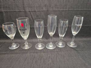 lot 40202 image: Set of 6 Clear Glass Champagne Flutes with Brand Logos