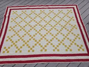 lot 40208 image: Handmade Nine Patch Quilt with Red Border