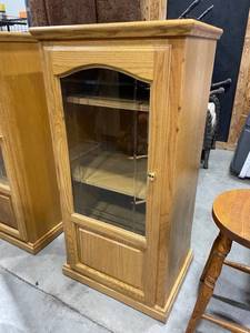 lot 207 image: Rolling glass front media cabinet 47 x 24 x 18 in