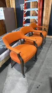 lot 215 image: Orange upholstered rolling chair trio