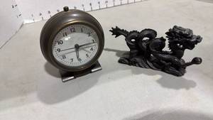 lot 1014 image: Vintage metal alarm clock and resin dragon