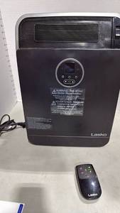 lot 1073 image: Lasko portable heater with remote