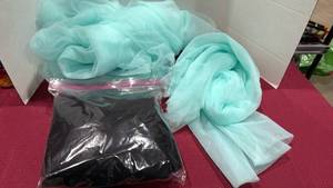 lot 2061 image: Sheer turquoise and black tulle or organza fabrics