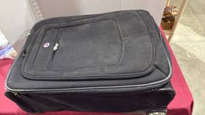 lot 2148 image: American Tourister luggage with back wheels