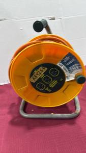 lot 2150 image: 100 ft electrical cord on wheel with power outlets