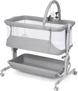 lot 471441 image: Retails for $101 Cowiewie Baby Bassinet Bedside Sleeper with Storage Basket,Wheels & Hanging Toys, Easy Folding Portable Bassinet with Wheels Adjustable Height Portable Bassinets for Newborn(Handbag)