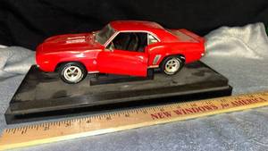 lot 10 image: Red Chevrolet Camaro Die Cast Model Car with Display Base