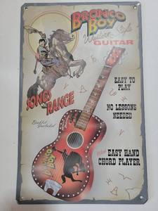 lot 20711 image: Bronco Boy Western Style Guitar Metal Sign 16x10 - Retail $25