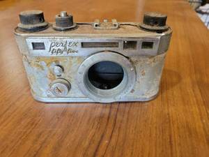 lot 20740 image: Perflex Fifty Five 35mm Film Camera paper weight  - Retail $25