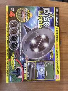 lot 20789 image: Bell  Howell Disk Lights Solar Powered LED Ground Lighting Set of 4 - Retail $15