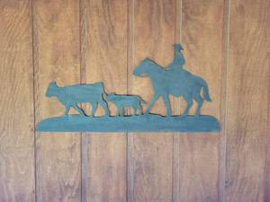 lot 20852 image: Metal Cowboy and Cattle Silhouette Wall Art - Retail $25