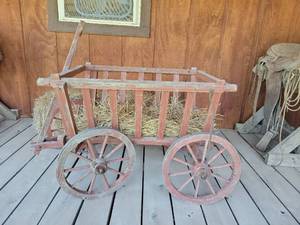 lot 20858 image: Wooden Farm Cart with Hay and Spoked Wheels - Retail $75
