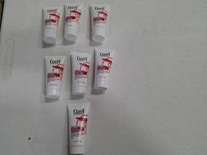 lot 8592 image: Curel Ultra Healing 1 oz for Intense Lotion for Ultra Dry Tight Skin 7 PACK