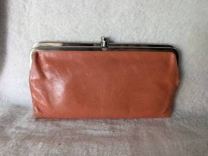 lot 2953 image: HOBO International Orange Leather Kiss Lock Frame Wallet