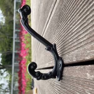 lot 728 image: 4 Pack Cast Iron Wall Hooks Antique Vintage Rustic Farmhouse Coat Hooks, Great for Coats, Bags, Towels, Hats, Mounting Screws Included - Retail $20
