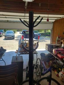lot 18 image: Freestanding horse shoe coat hanger  with Round Base 74in tall