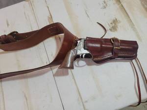 lot 30 image: Western Revolver toy with Leather Holster and Ammunition Belt Set