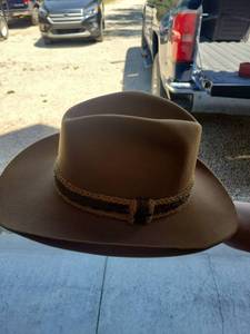 lot 75 image: The gun club by stetson size 6 and 34sBrown Felt Cowboy Hat with Decorative Band