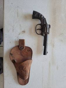 lot 85 image: Cast Iron Cap Gun with Leather Holster