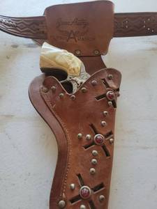 lot 86 image: Gene Autry Flying A Ranch Cap Gun with Leather Holster Set