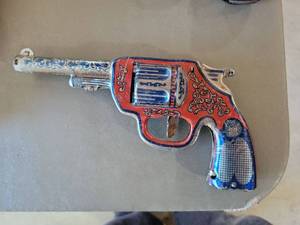 lot 88 image: Decorative Metal Toy Revolver with Ornate Red and Blue Design