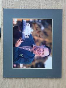 lot 217 image: Signed photograph features PGA golfer Mark OMeara holding the Masters Tournament trophy.