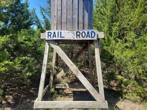 lot 258 image: Railroad Sign. Says crossing on backside