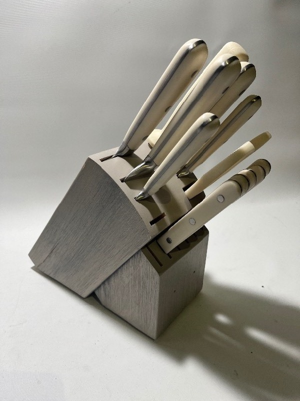 lot 657 image: 12 Piece Martha Stewart Knife Set White Handle - Light Grey Block - 2 Open Spots - Knives Never Been Used