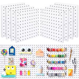 lot 33131 image: Pegboard Wall Organizer Panels, White Pegboard Wall Mount for Craft Room, Garage, Kitchen, Living Room, Bathroom, and Study Room, Peg Boards for Walls Easy to Install - Retail $25