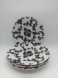 lot 1103 image: Black and White ceramic plates.