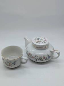 lot 1203 image: Floral Porcelain Teapot and teacup with Gold Trim